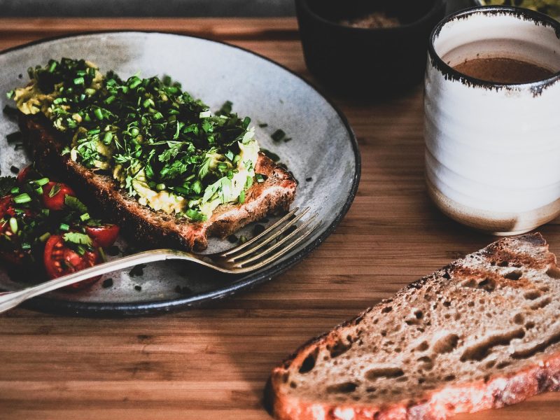 Vegan meal with avocado toast and coffee, square crop